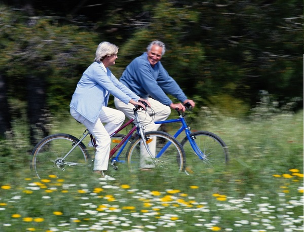 Two retirees biking in the country